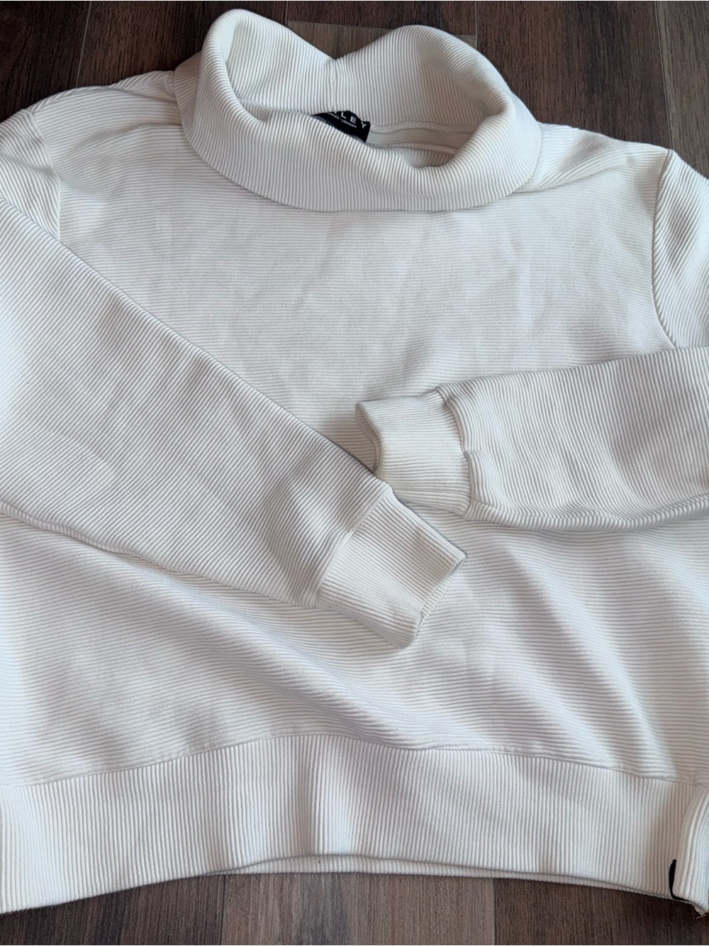 Varley Black Logo Tag on Cream Fabric